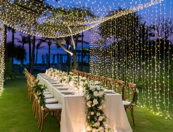 A Long Table Set With Flowers