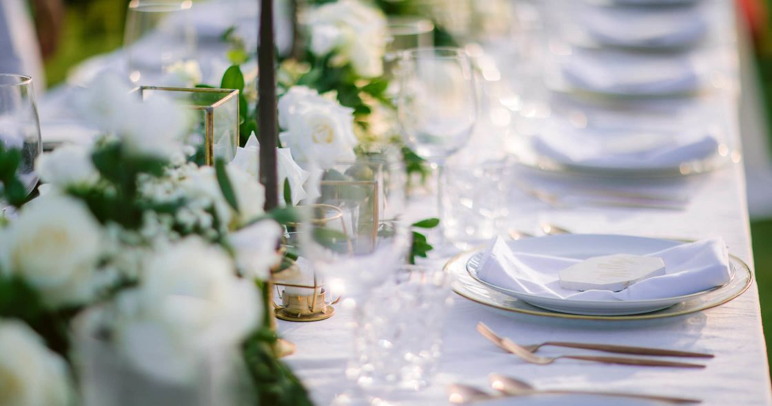 A Table With Plates And Glasses