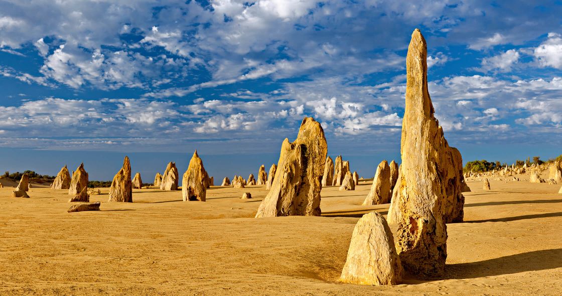 A Group Of Large Rocks In A Desert