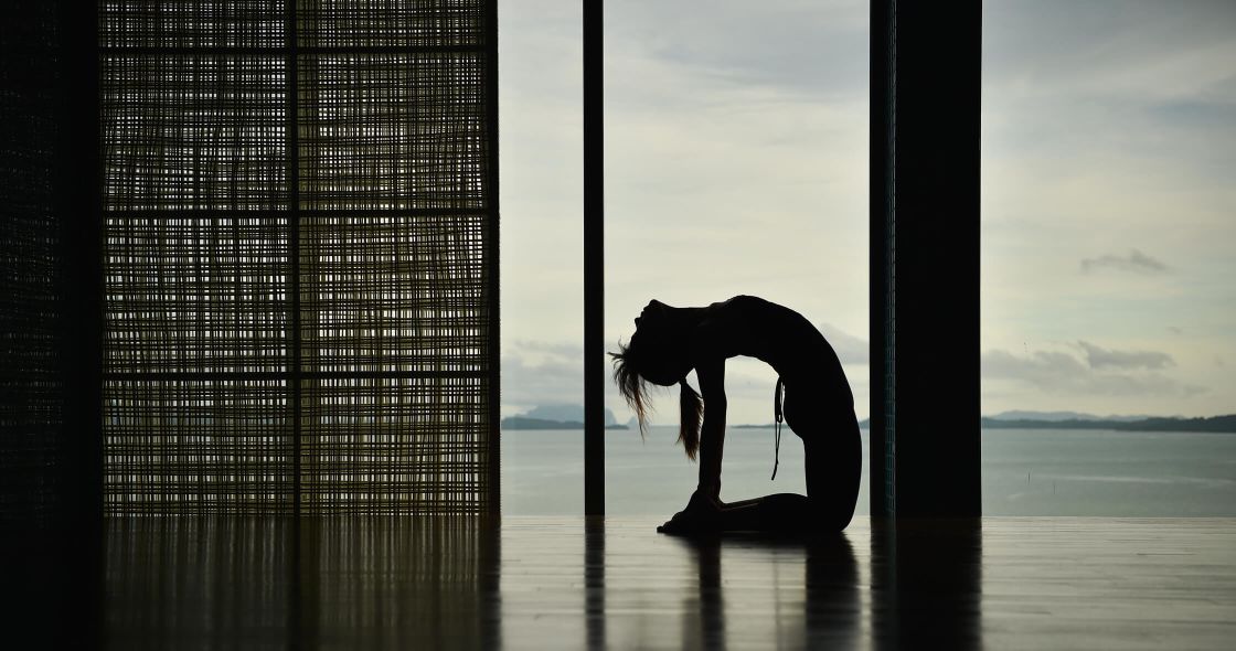 A Horse Standing On A Rock In The Water