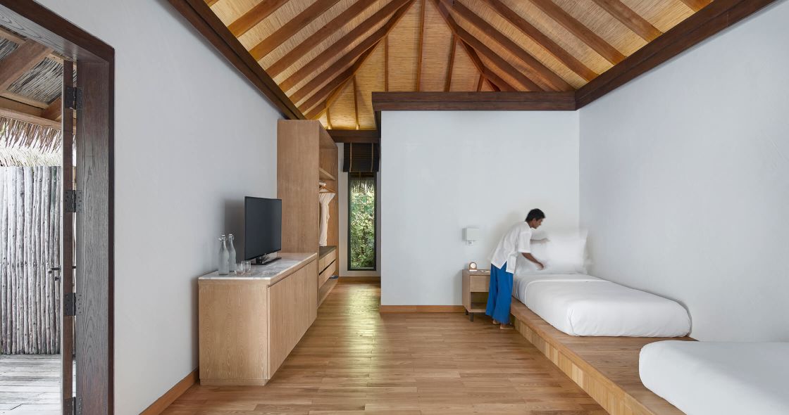 A Bedroom With A Wooden Floor