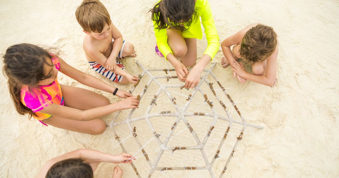 A Group Of Children Playing With Sand