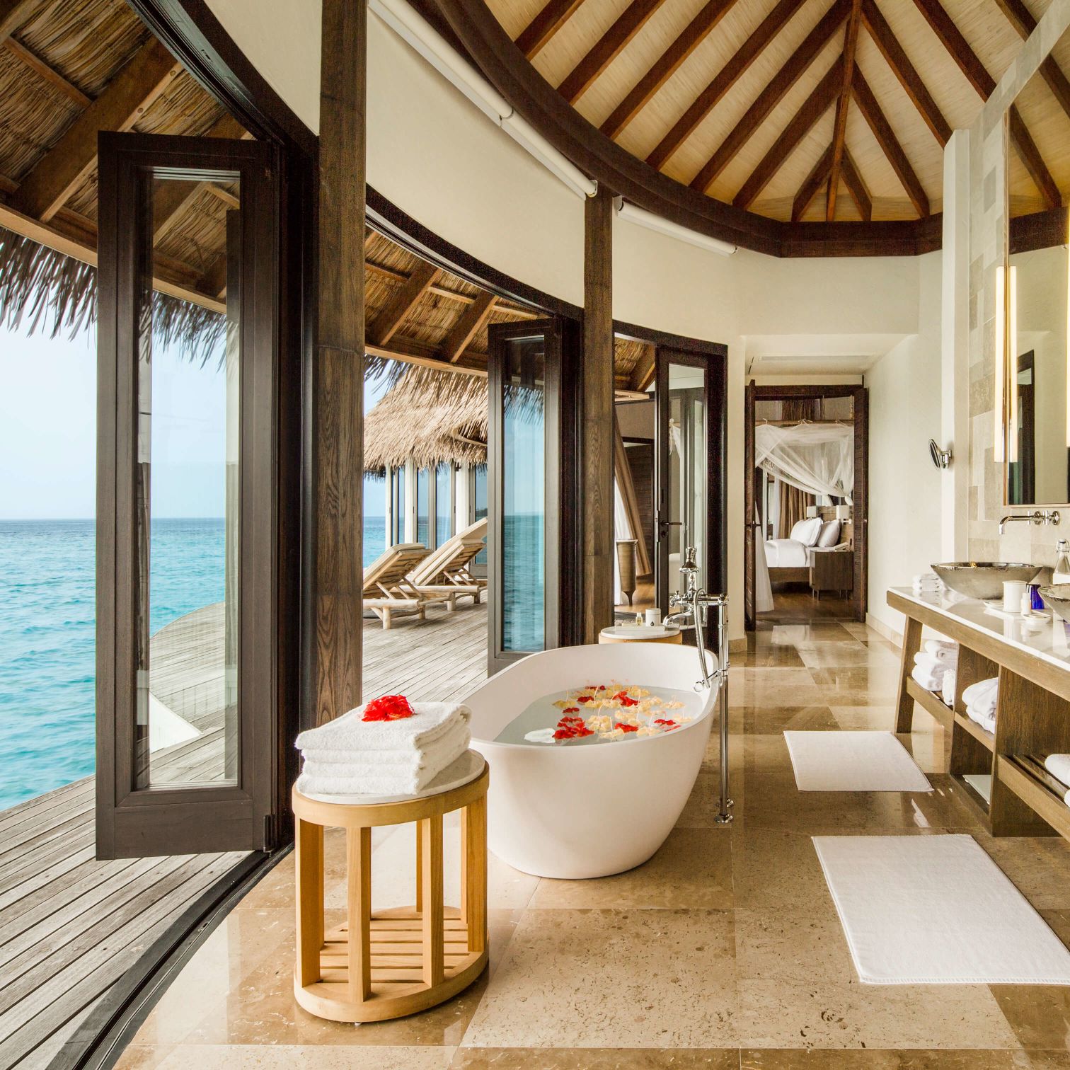 A Room Filled With Furniture And A Large Window