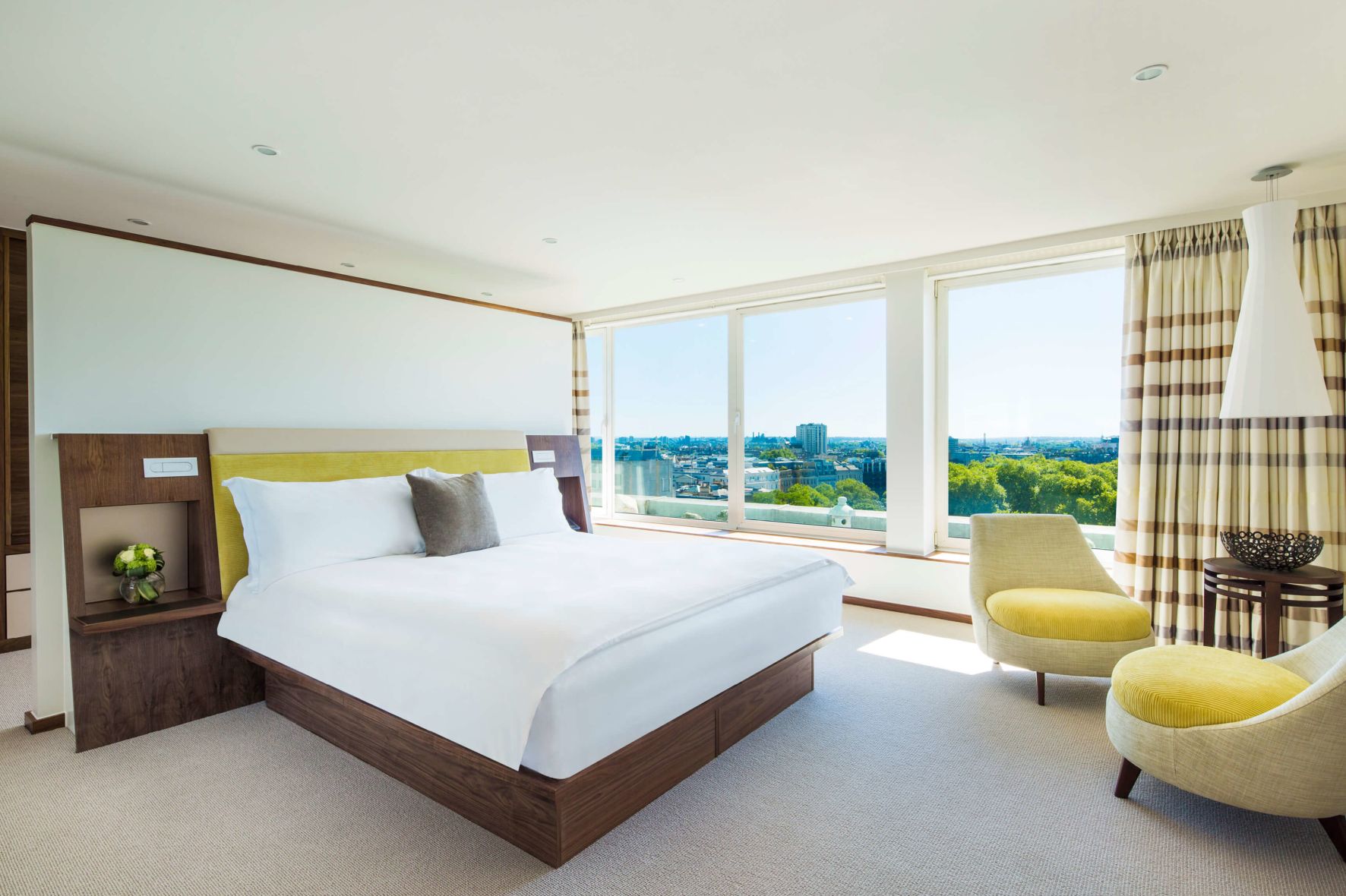 A Bedroom With A Large Window