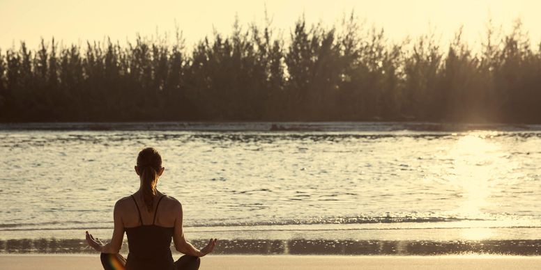 A Man Sitting On A Beach