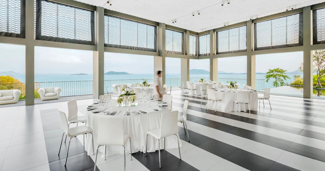 A Room With A Table And Chairs