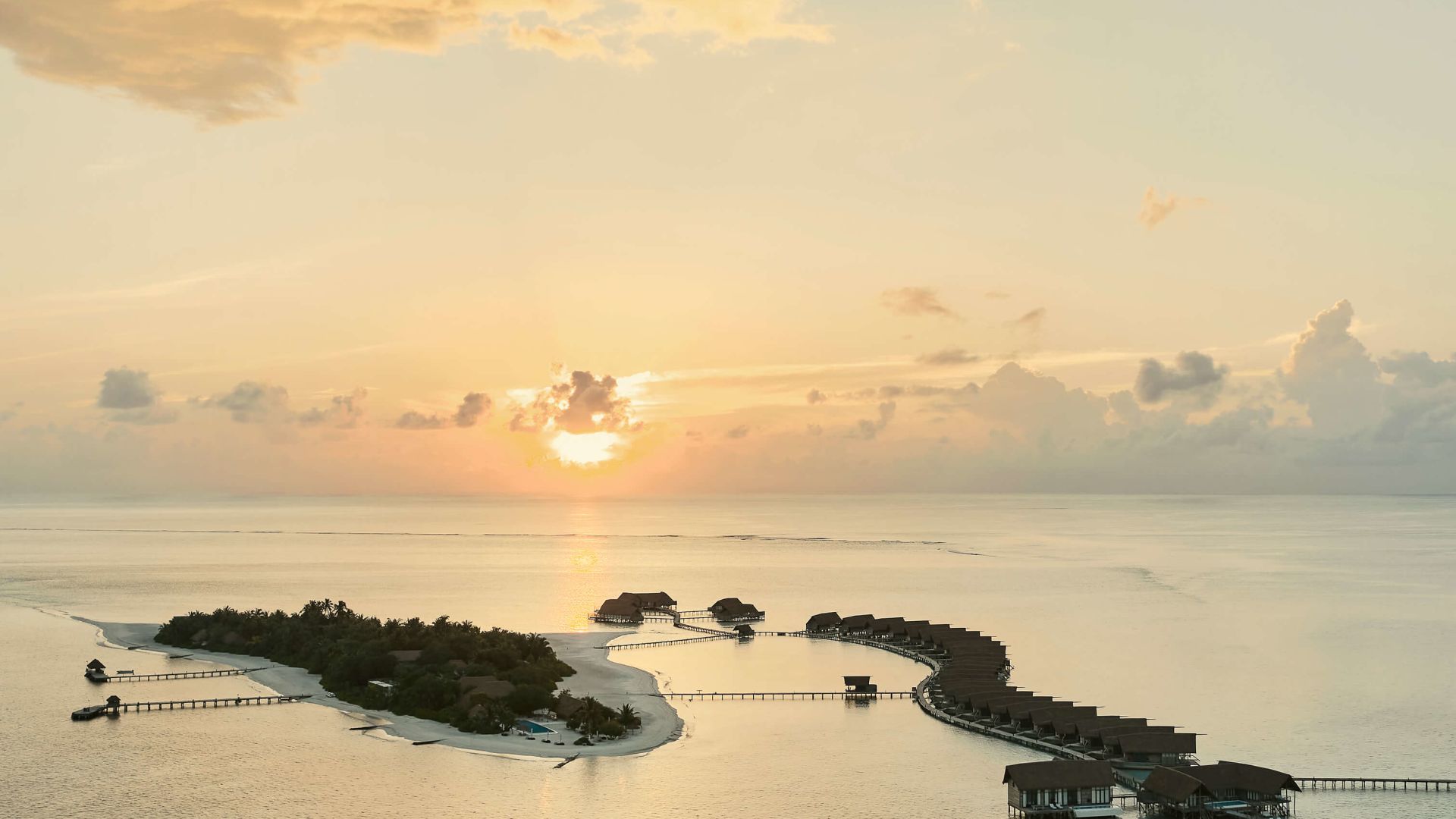 A Beach With Islands And Boats