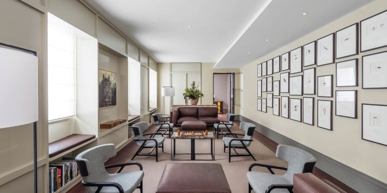 A Room With A Couch And Chairs