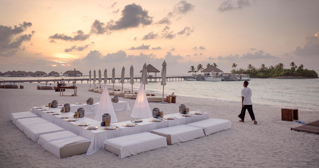 A Person Walking On A Beach