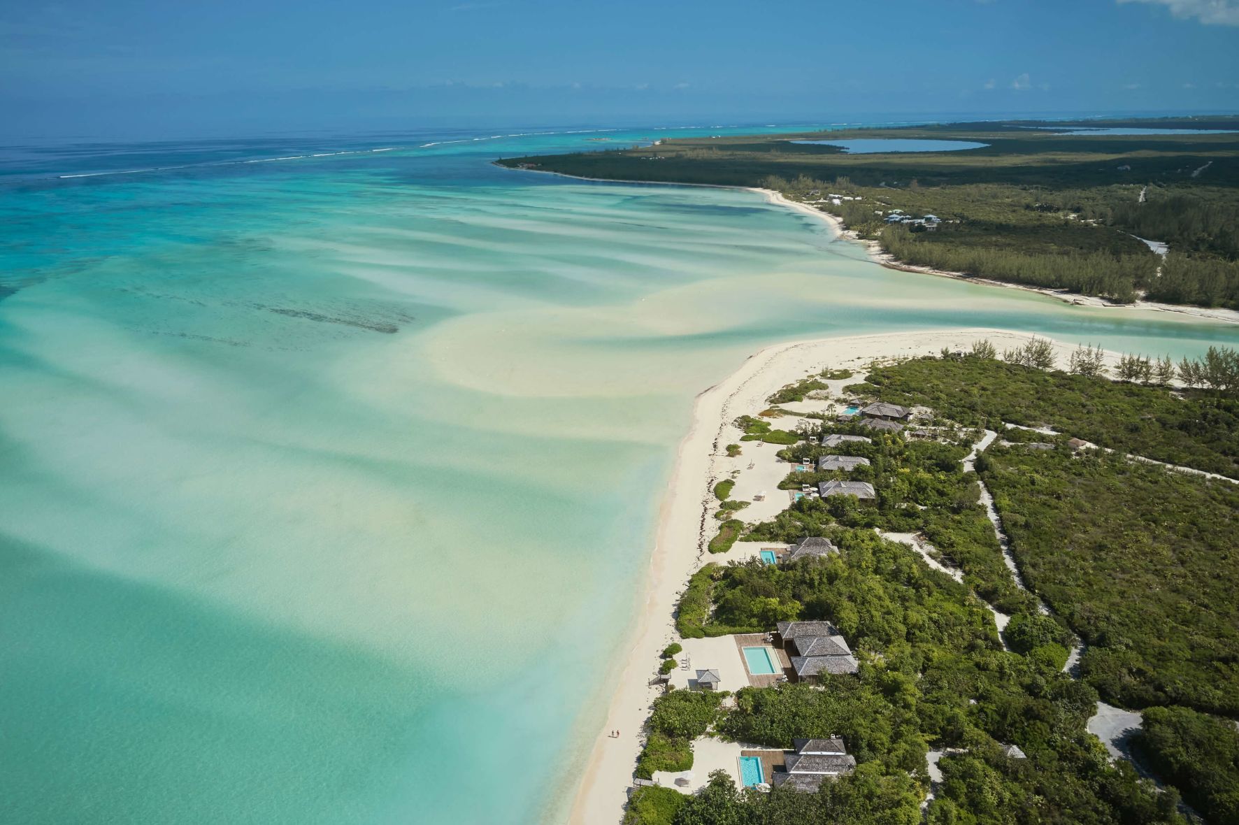 A Beach With Houses And Trees