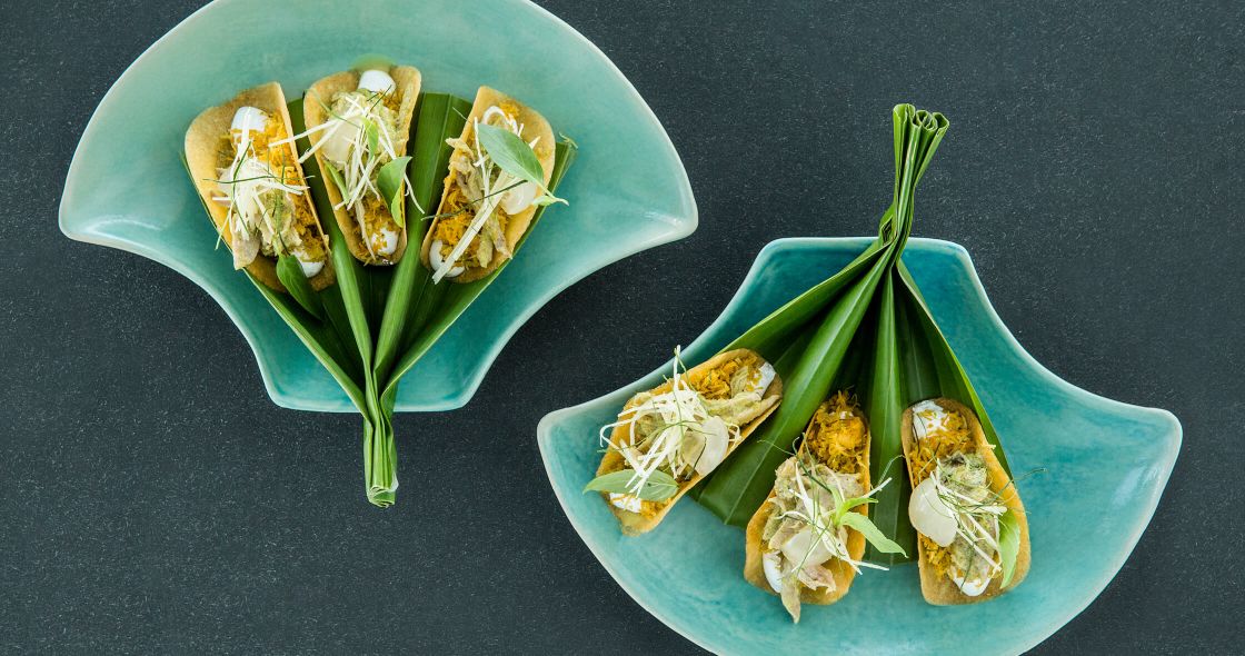 A Couple Of Plates With Sushi On Them