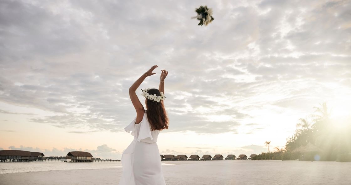 A Person With A Crown And A White Dress With A Butterfly On The Head And A Body Of
