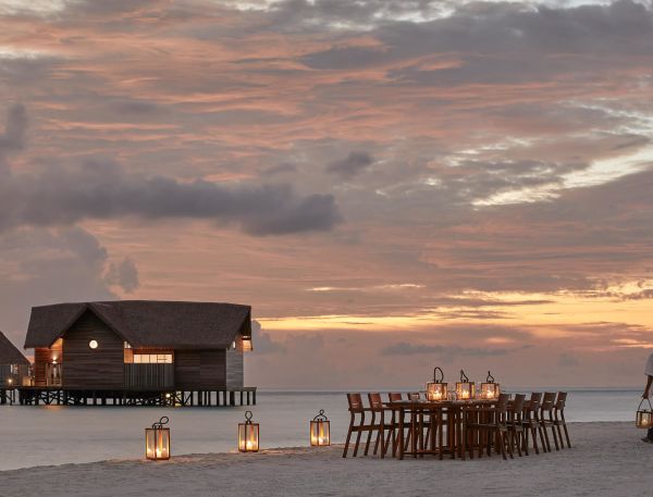 A Person Walking On A Beach