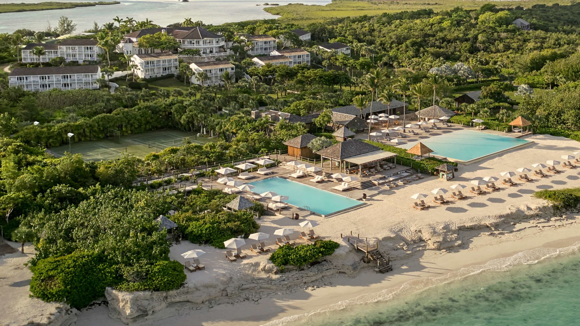A Beach With Houses And Trees