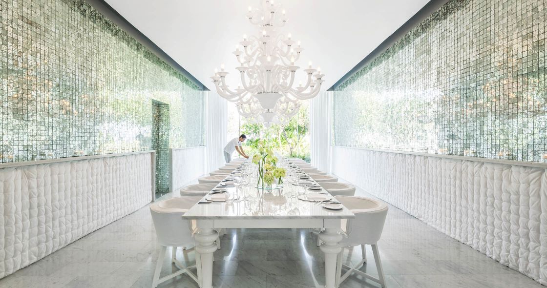 A Room With A Table And Chairs