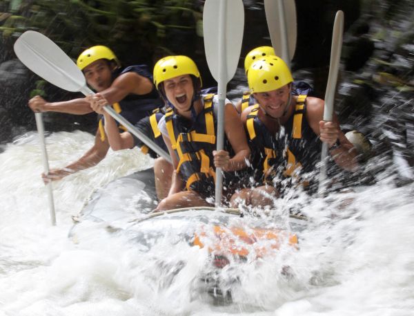 A Group Of People In A Raft