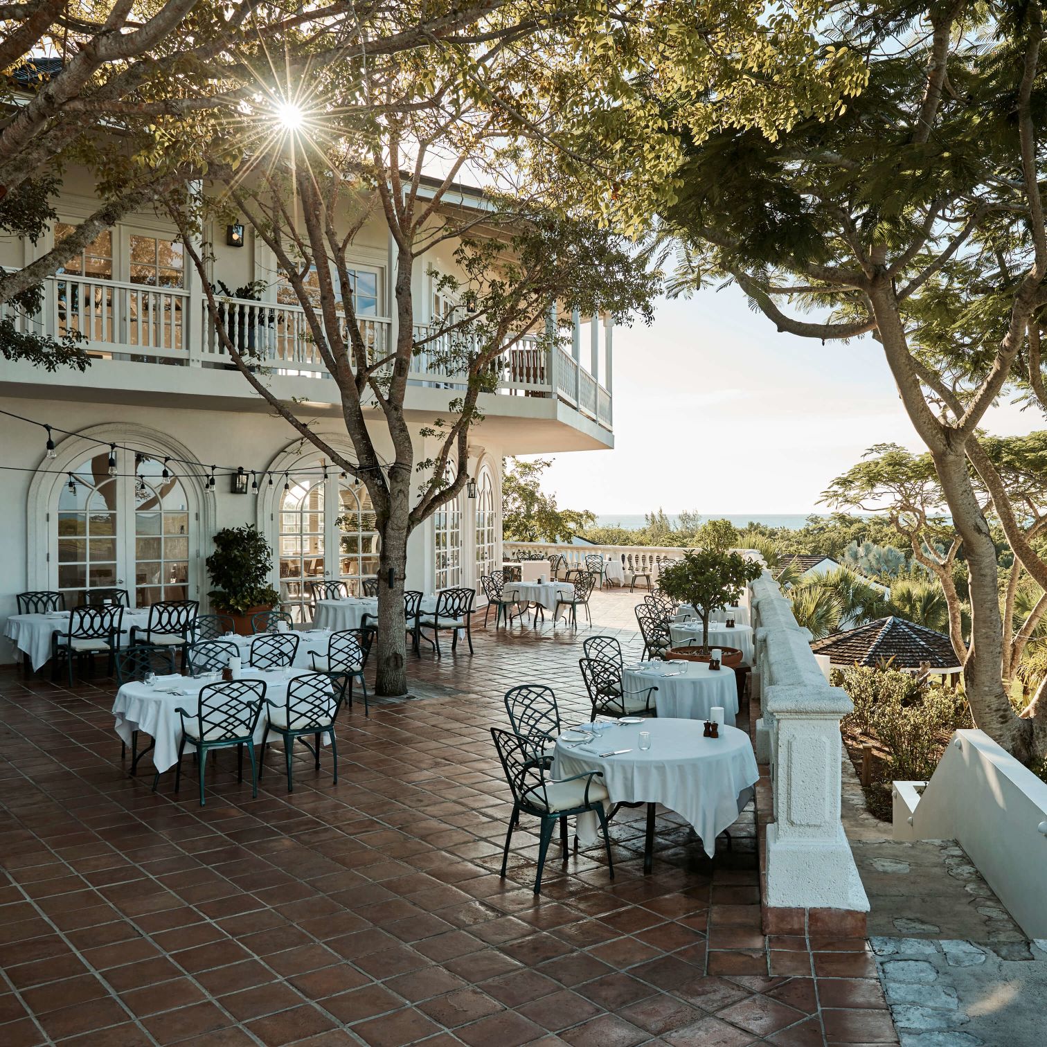 A Courtyard With Tables And Chairs