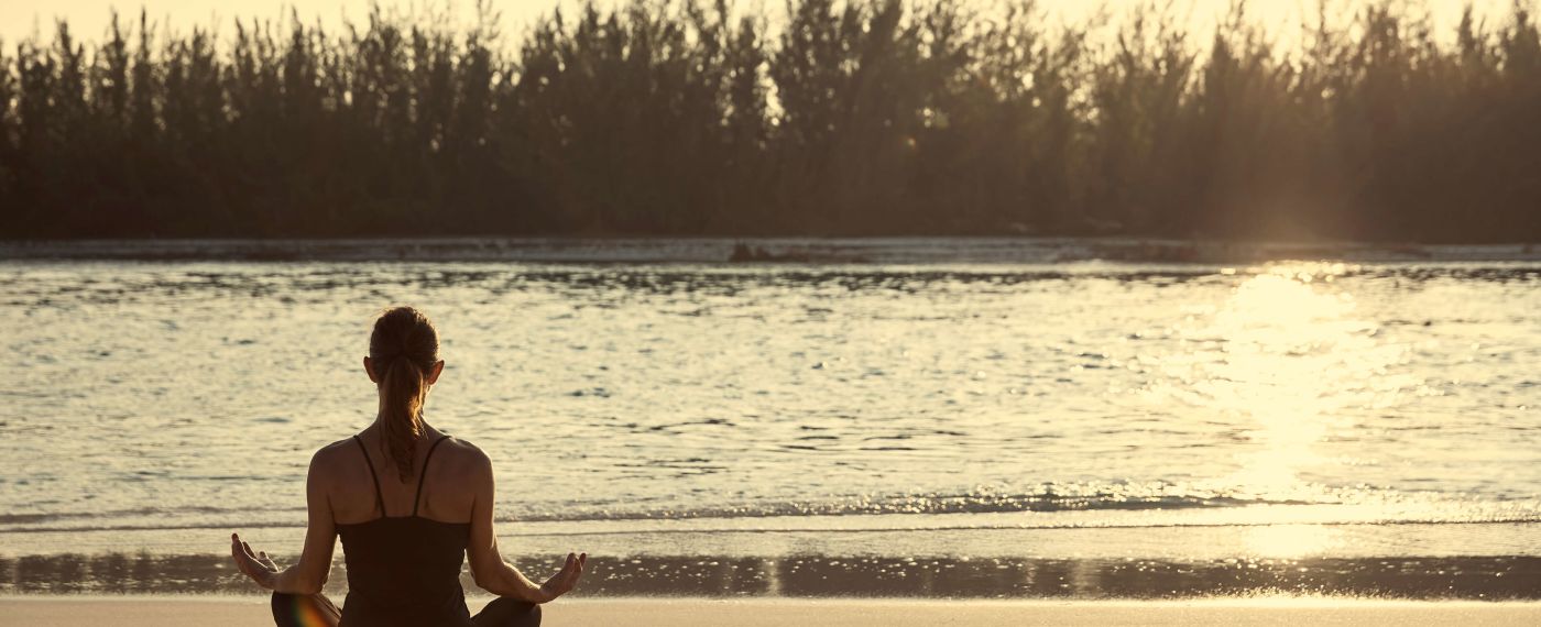 A Man Sitting On A Beach