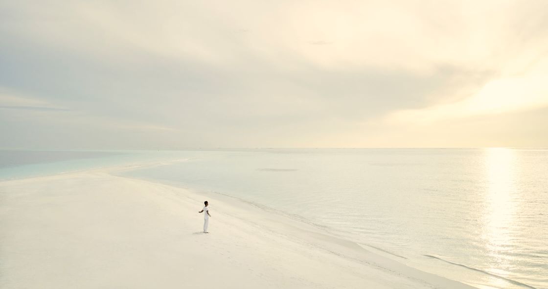A Person Walking On A Snowy Road