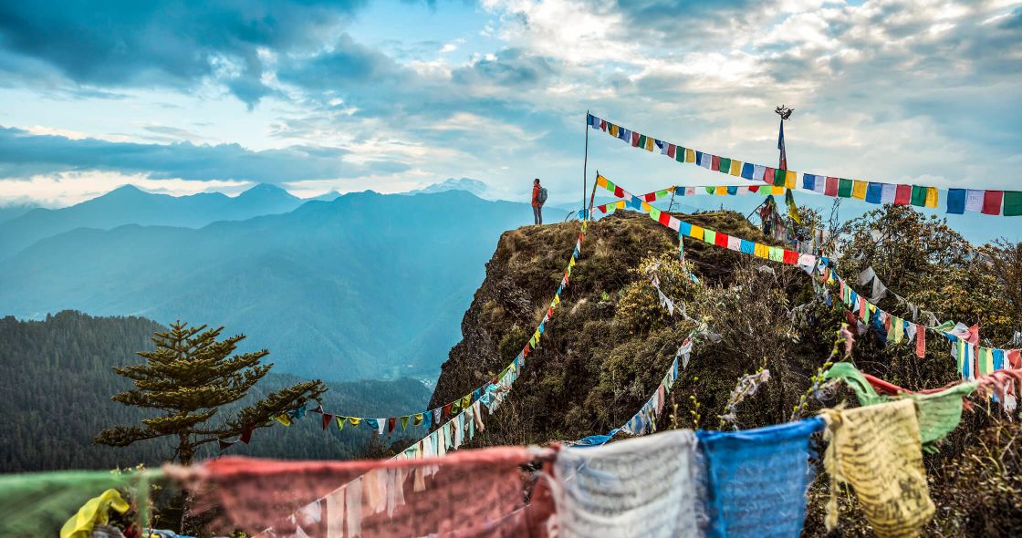 A Person Standing On A Rope Bridge