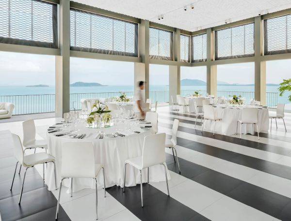 A Room With A Table And Chairs