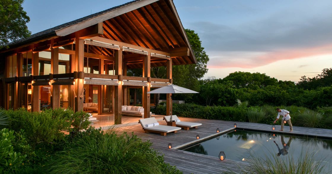 A Person Standing Next To A Pool