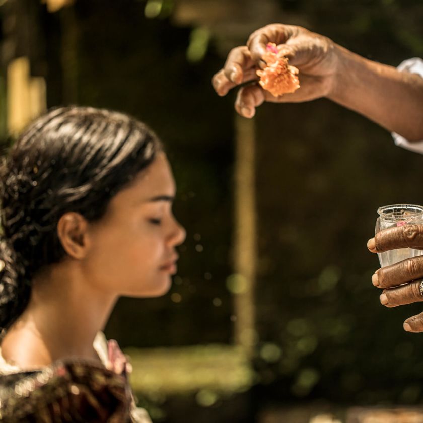 A Woman Holding A Flower