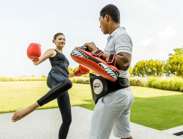 A Man And A Woman Playing Basketball