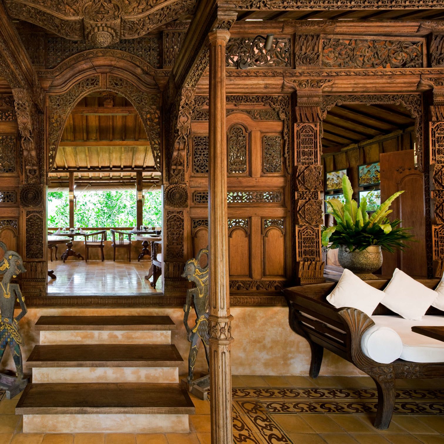 A Room With A Staircase And A Mirror