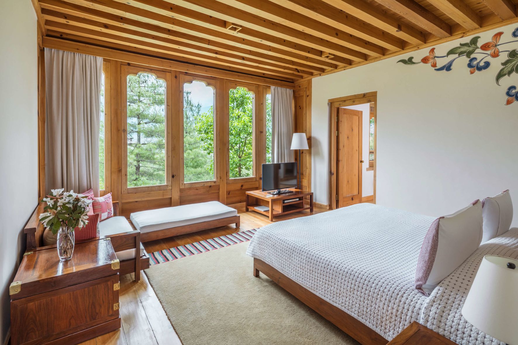 A Bedroom With A Large Window